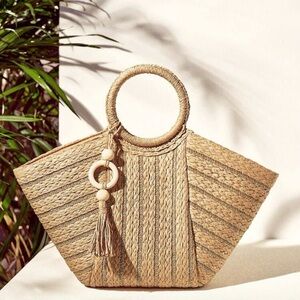 Brand New still in original packaging, woven beige bag.